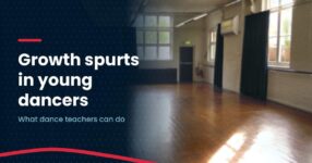 Home Photo of an empty, sunlit community dance studio with a wooden floor, barre and tall windows, with the headline Growth spurts in young dancers