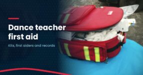 Home Photo of a red first aid bag packed with supplies, with the headline Dance teacher first aid