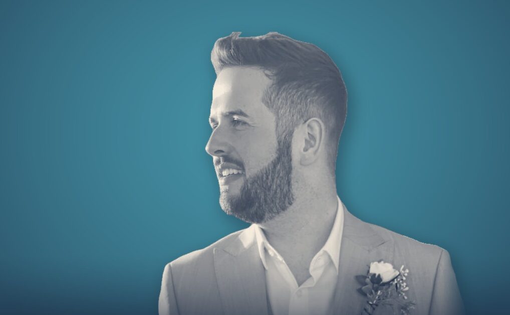 Adam Duffy, portrait on a teal background