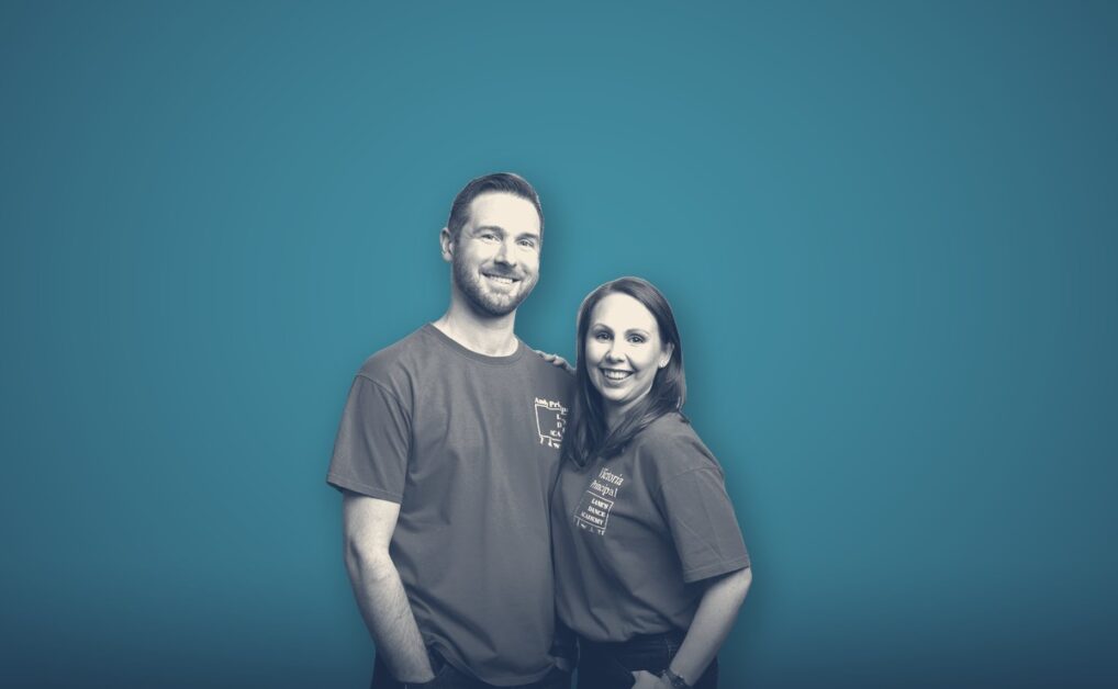 Andy and Victoria Lane, portrait on a teal background
