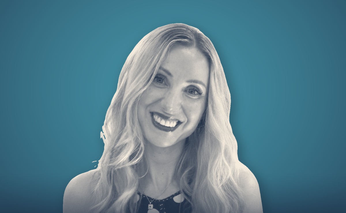 Emily Binyon, portrait on a teal background