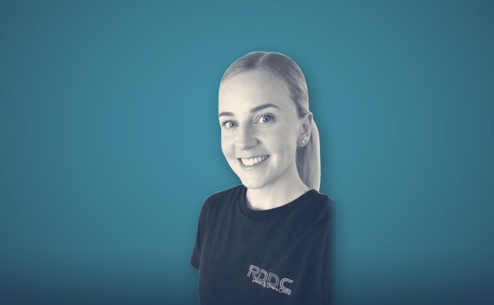 Jemma Dransfield, portrait on a teal background